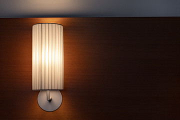 reading light of a lamp in the bedroom of a hotel