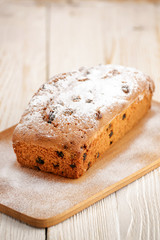 Delicious homemade cake with raisins on a light wooden background. close-up. rustic. copy space.