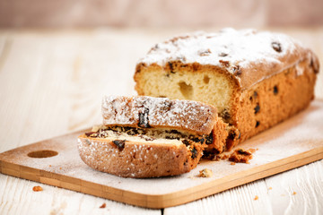 Delicious homemade cake with raisins on a light wooden background. close-up. rustic. copy space.