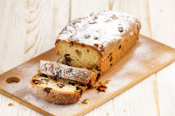 Delicious homemade cake with raisins on a light wooden background. close-up. rustic. copy space.