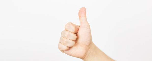 Hand with thumb up isolated on white background - like sign.