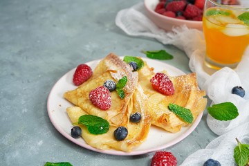 Homemade Crepes with fresh fruits and berries, selective focus