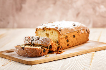 Delicious homemade cake with raisins on a light wooden background. close-up. rustic. copy space.