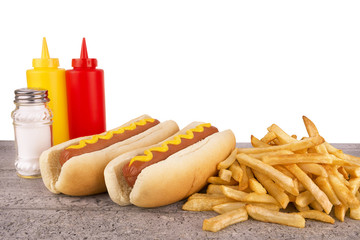 Duo of hot dogs and french fries on table. Fast food restaurant concept. Copy space for your text.