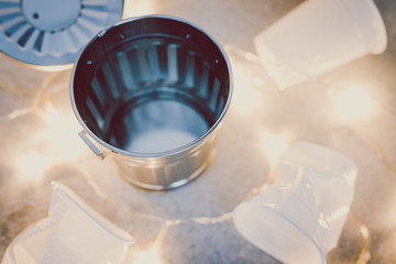 disposable cups and garbage bin concept of reducing single-use plastic