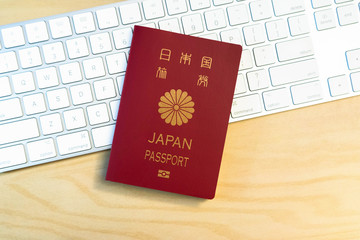 Japanese passport on keyboard