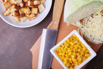 Fresh Chinese cabbage, Sweet canned corn, Delicious crispy croutons and canned tuna. Ingredients for dietary salad.