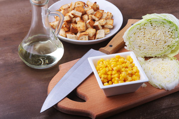 Fresh Chinese cabbage, Sweet canned corn, Delicious crispy croutons and canned tuna. Ingredients for dietary salad.