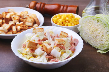Fresh Chinese cabbage, Sweet canned corn, Delicious crispy croutons and canned tuna. Ingredients for dietary salad.