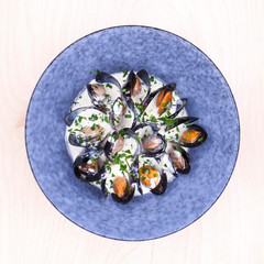 Fried mussels in the shell and in cream sauce