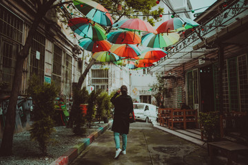 Girl with under umbrellas