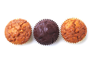 Cupcake, muffin with raisins and chocolate isolated on white background. Delicious homemade Muffins. Top view.