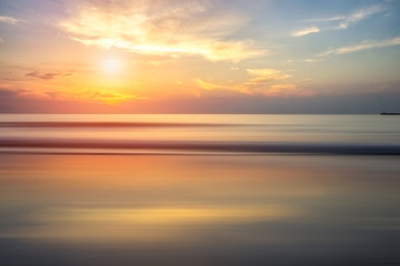 Naklejka na ściany i meble Calm sea and colorful sky during sunrise. Bright seascape background.