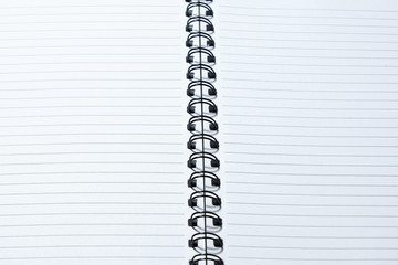Opened notebook with a strip on a spring. view from above. Place to write.