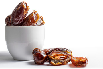 Date palm fruit closeup macro on a white background