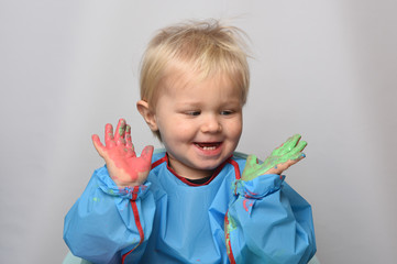 child with colorful paint