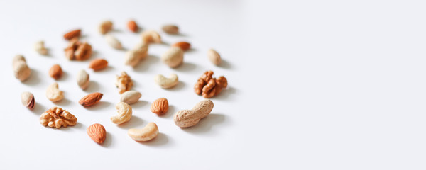 Cashew, hazelnuts, walnuts, almonds in circle form. Top view or flat-lay. Copy space