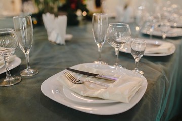Crystal dishes on a restaurant table, open background.