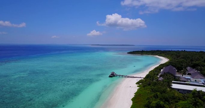 Resort on idyllic Hanimaadhoo island in the Maldives Indian ocean aerial dolly