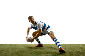 The silhouette of one caucasian rugby man player isolated on white background. Studio shot of fit man in motion or movement with ball. Jump and action concept. an incredible strain of all forces