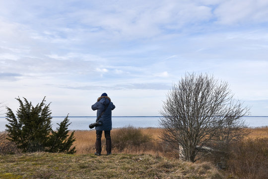 Photographer in a coastal landscape