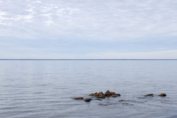 Fototapeta premium Seascape with stones in a calm water
