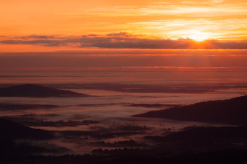 Fototapeta na wymiar Morning Light and Fog Over Virginia Piedmont. Shenandoah National Park.