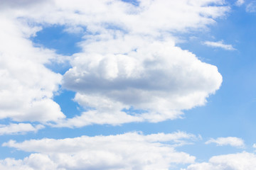 Naklejka na ściany i meble Bright blue sky with large white clouds of nature