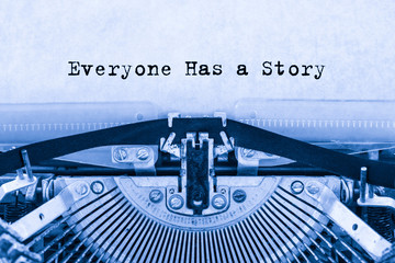 Everyone Has a Story printed on a sheet of paper on a vintage typewriter. writer. journalist