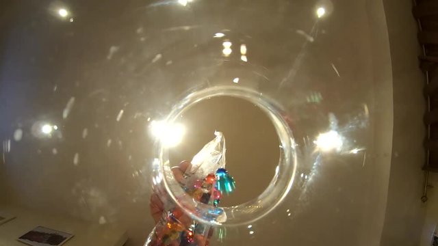 Orbis balls falling in to the jar .