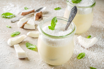 Vegan coconut panna cotta dessert in glass jar