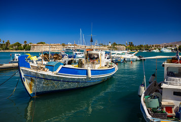 Fototapeta na wymiar Greek fishing boats moored in Kos fishing port