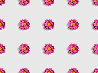 pink paper flowers on grey, seamless background pattern