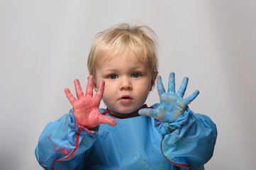 child with colorful paint
