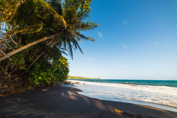 Dark sand in Grande Anse beach in Basse Terre