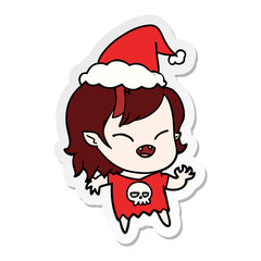 sticker cartoon of a laughing vampire girl wearing santa hat