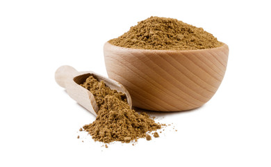 garam masala mix in wooden bowl and scoop isolated on white background. Spices and food ingredients.