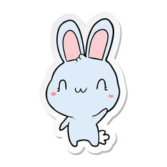 sticker of a cartoon rabbit waving