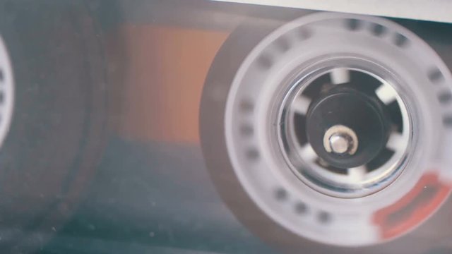 Audio Cassette in the Tape Recorder Playing and Rotates.