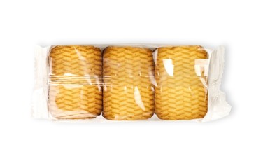 Golden cookies in a transparent package. Close up. Isolated on white background
