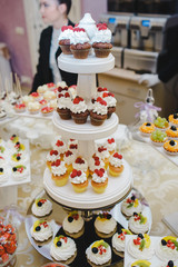 Candy bar with sweets and cakes. Background texture