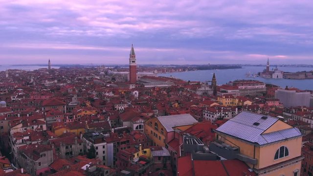 The city of Venice Italy during sunrise with a view over the roofes.