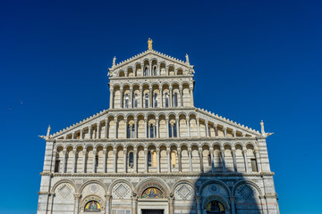 Fototapeta premium The leaning tower of pisa at Piazza del Miracoli Duomo square,Camposanto cemetery in Tuscany, Italy