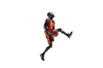 Foto op Canvas Full length portrait of a basketball player with a ball isolated on white studio background. advertising concept. Fit african anerican athlete jumping with ball. Motion, activity, movement concepts. © master1305