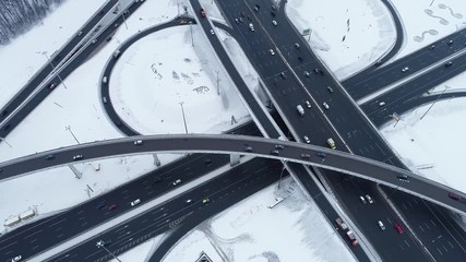 Aerial view of a freeway intersection Snow-covered in winter.