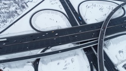 Aerial view of a freeway intersection Snow-covered in winter.