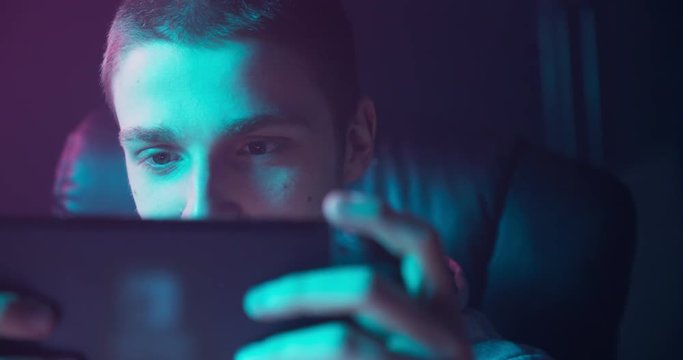 Portrait of a man playing games on a switch console