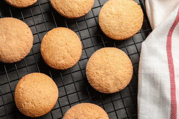 Baking grid with Danish butter cookies on grey background, top view