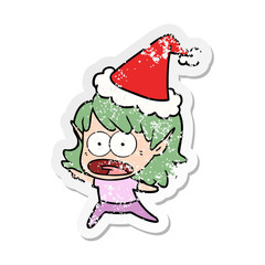 distressed sticker cartoon of a shocked elf girl wearing santa hat