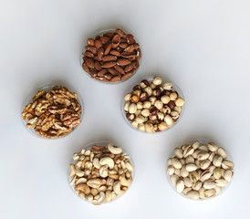 Healthy food. Nuts mix assortment on stone table top view. Collection of different legumes for background image close up nuts, pistachios, almond, cashew nuts, peanut, walnut. image